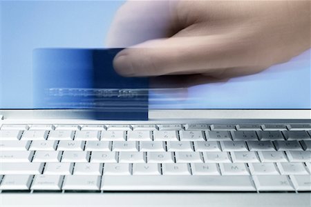 simsearch:700-00557232,k - Hand Swiping Credit Card On Computer Keyboard Stock Photo - Rights-Managed, Code: 700-00478041