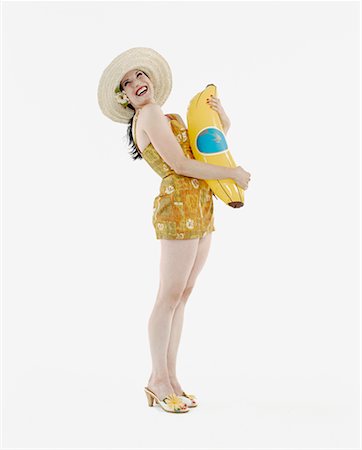 Woman Holding Inflatable Banana Stock Photo - Rights-Managed, Code: 700-00478109