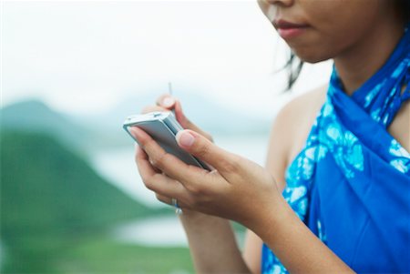 Woman Using Palm Pilot, St Kitts, Caribbean Stock Photo - Rights-Managed, Code: 700-00478719