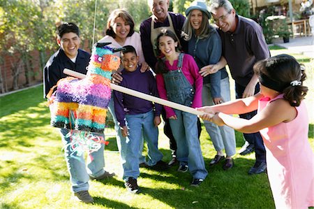 fat hispanic moms - Family Playing with Pinata in Backyard Stock Photo - Rights-Managed, Code: 700-00481631