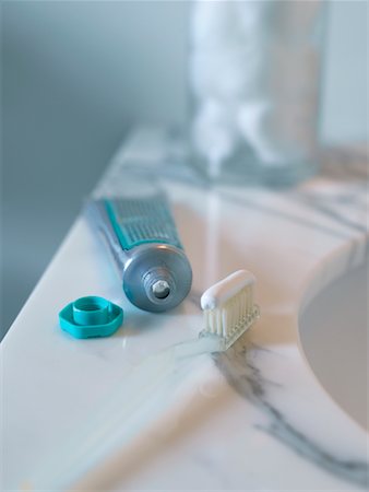 Toothbrush and Toothpaste by Sink Fotografie stock - Rights-Managed, Codice: 700-00506792