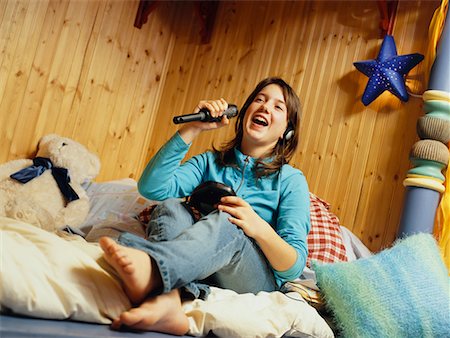 playing music on the mobile - Teenage Girl Singing in Bedroom Stock Photo - Rights-Managed, Code: 700-00506894