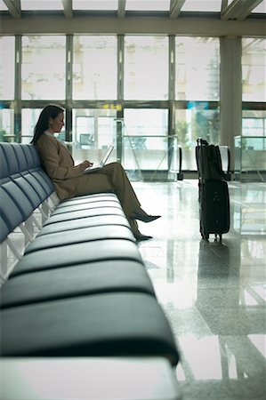 Woman with Laptop in Waiting Area Stock Photo - Rights-Managed, Code: 700-00506926