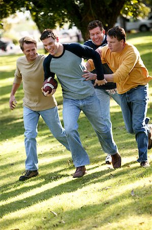 friends playing football - Men Playing Football Stock Photo - Rights-Managed, Code: 700-00514020