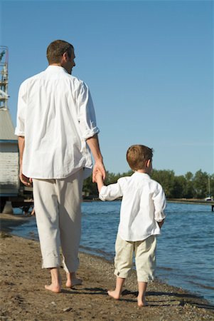 father son caucasian walking two people casual clothing - Father and Son Walking on Beach Stock Photo - Rights-Managed, Code: 700-00514038