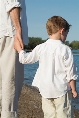 Son Holding Father's Hand at Beach Stock Photo - Rights-Managed, Code: 700-00514042