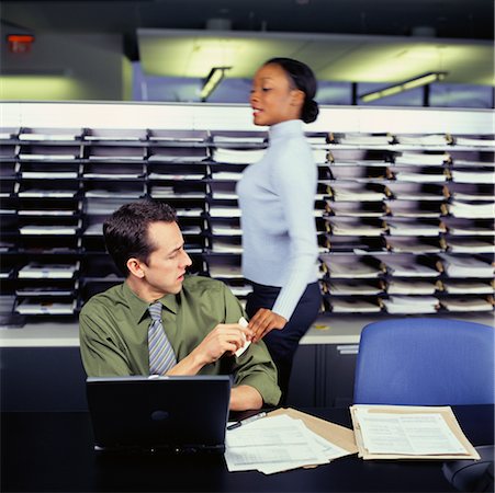 Businesswoman Passing Note to Businessman Stock Photo - Rights-Managed, Code: 700-00514708