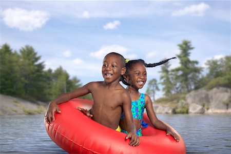 Children Playing With Inner Tube Stock Photo - Rights-Managed, Code: 700-00514831