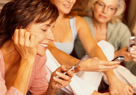 showing phones group - Women Looking at Cellular Phones Stock Photo - Rights-Managed, Code: 700-00514894