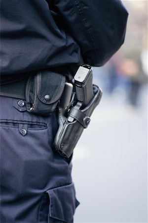 simsearch:632-08227905,k - Police Officer's Gun in Holster Stock Photo - Rights-Managed, Code: 700-00514973