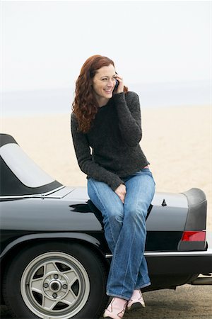 Woman Sitting On Back of Car Stock Photo - Rights-Managed, Code: 700-00515036