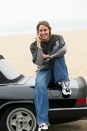 Man Sitting On Back of Car Stock Photo - Rights-Managed, Code: 700-00515038