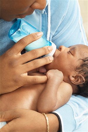 feeding a new born baby - Mother Feeding Newborn Baby Stock Photo - Rights-Managed, Code: 700-00515153