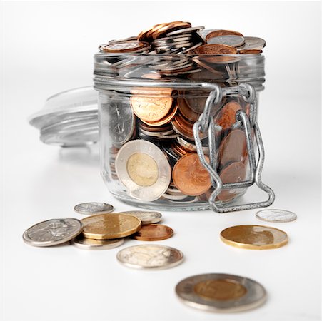 Jar Overflowing with Coins Foto de stock - Con derechos protegidos, Código: 700-00515189