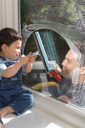 father and son overalls - Father and Son Looking at Each Other through Window Foto de stock - Con derechos protegidos, Código: 700-00515210