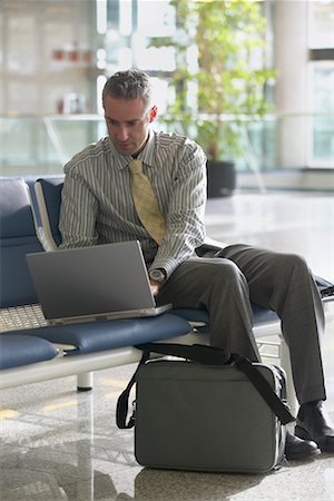 simsearch:700-02797980,k - Businessman Using Laptop in Airport Stock Photo - Rights-Managed, Code: 700-00515238