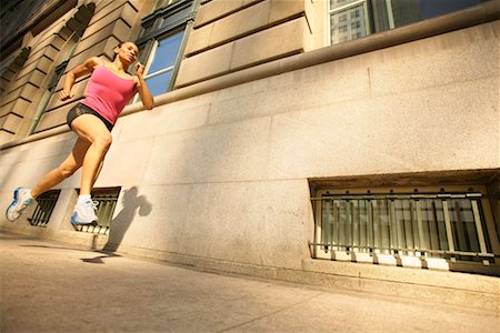female jogging in spandex - Runner Running Down City Street Stock Photo - Rights-Managed, Code: 700-00515324