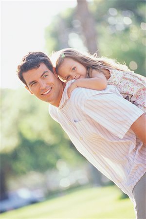 piggyback ride in the garden - Girl Riding on Father's Back Stock Photo - Rights-Managed, Code: 700-00515621