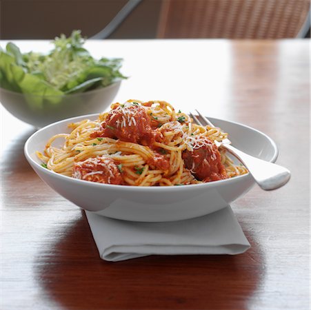 spaghetti table - Spaghetti and Meatballs with Salad Stock Photo - Rights-Managed, Code: 700-00515721