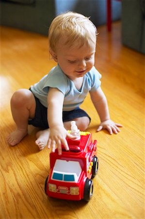 fire truck close - Child Playing with Toy Truck Stock Photo - Rights-Managed, Code: 700-00517644