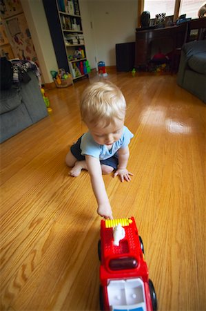 fire truck close - Child Playing with Toy Truck Stock Photo - Rights-Managed, Code: 700-00517645