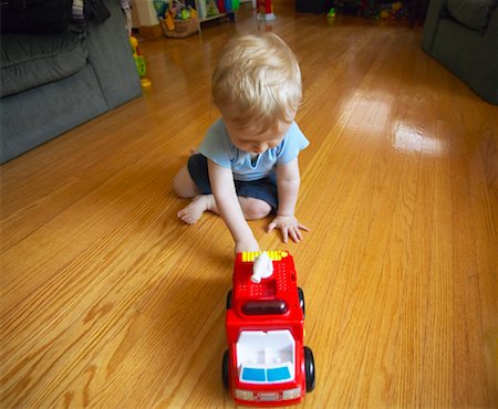 fire truck close - Child Playing with Toy Truck Stock Photo - Rights-Managed, Code: 700-00517646