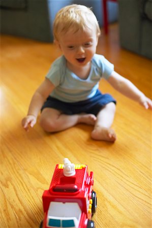 fire truck close - Child Playing with Toy Truck Stock Photo - Rights-Managed, Code: 700-00517647