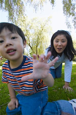 sneaking boy - Mother and Son at Park Stock Photo - Rights-Managed, Code: 700-00517679