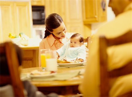 pictures of baby eating dinner with family - Family at Dinner Table Stock Photo - Rights-Managed, Code: 700-00517757