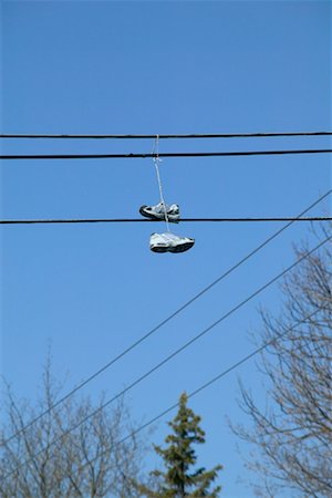 electricity humor - Shoes Hanging from Power Line Stock Photo - Rights-Managed, Code: 700-00518601