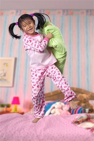 Child Jumping on Bed Stock Photo - Rights-Managed, Code: 700-00519361