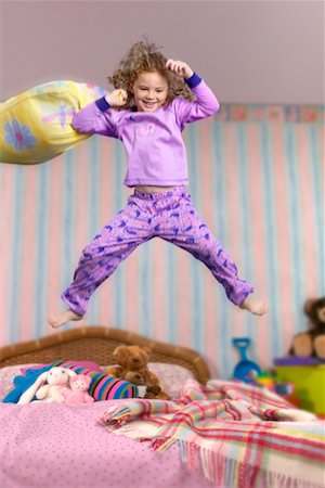 pillow fighting kids - Child Jumping on Bed Stock Photo - Rights-Managed, Code: 700-00519370
