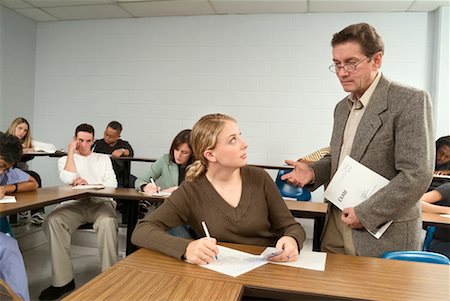 picture of teacher catching student cheating at desk - Student Caught Cheating On a Test Stock Photo - Rights-Managed, Code: 700-00519499