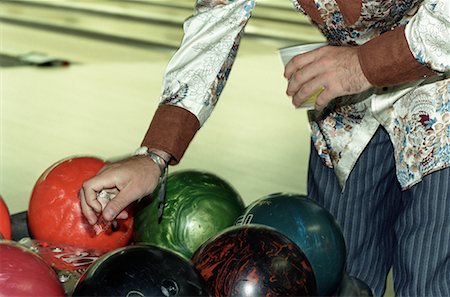 Bowler Reaching for Bowling Ball Stock Photo - Rights-Managed, Code: 700-00513715