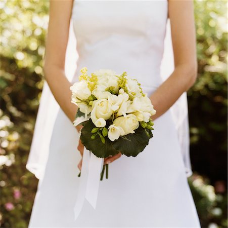 Bride Holding Bouquet of Flowers Fotografie stock - Rights-Managed, Codice: 700-00524042