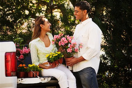 Man and Woman with Flowers on Back of Pick-Up Truck Stock Photo - Rights-Managed, Code: 700-00524196