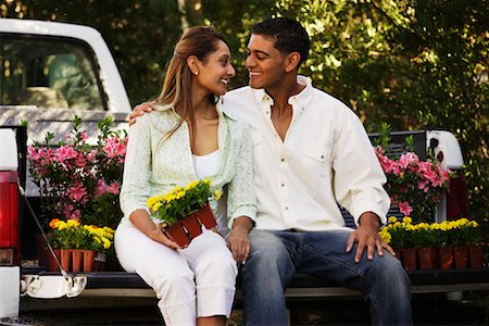 Couple in Back of Pickup Truck With Flowers Stock Photo - Rights-Managed, Code: 700-00524199