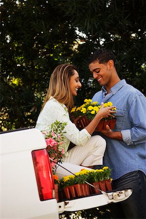 Couple in Back of Pickup Truck With Flowers Stock Photo - Rights-Managed, Code: 700-00524200