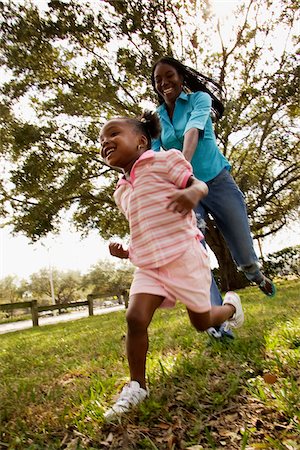 Mother and Daughter Running Fotografie stock - Rights-Managed, Codice: 700-00524518