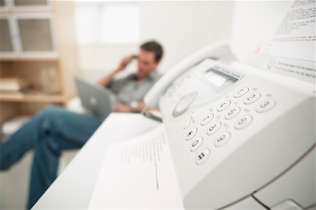 fax - Fax Machine with Businessman in Background Fotografie stock - Rights-Managed, Codice: 700-00524641