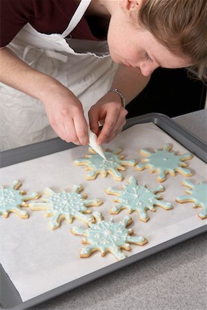 snowflake cookie - Woman Decorating Cookies Stock Photo - Rights-Managed, Code: 700-00526854