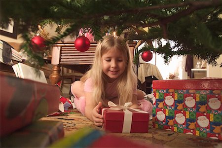 Girl Opening Christmas Presents Stock Photo - Rights-Managed, Code: 700-00527493