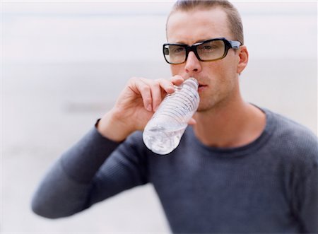 satisfied (thirst) - Man Drinking Water Foto de stock - Con derechos protegidos, Código: 700-00527864