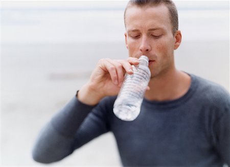satisfied (thirst) - Man Drinking Water Foto de stock - Con derechos protegidos, Código: 700-00527863