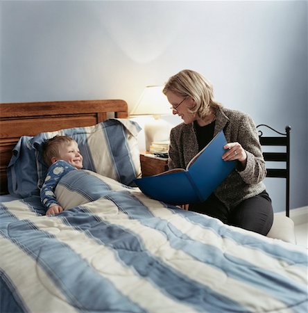 Mother Reading A Bedtime Story to Her Son Stock Photo - Rights-Managed, Code: 700-00527881