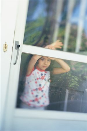 screen door - Girl Looking Out Screen Door Stock Photo - Rights-Managed, Code: 700-00528001