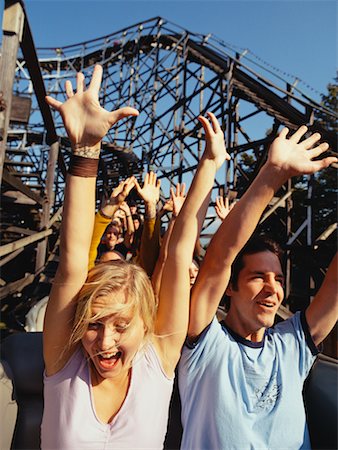 Happy looking people on a rollercoaster Stock Photos Page 1