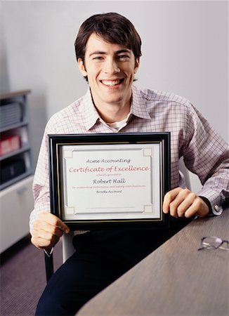 Portrait of Businessman Holding Certificate Fotografie stock - Rights-Managed, Codice: 700-00528773