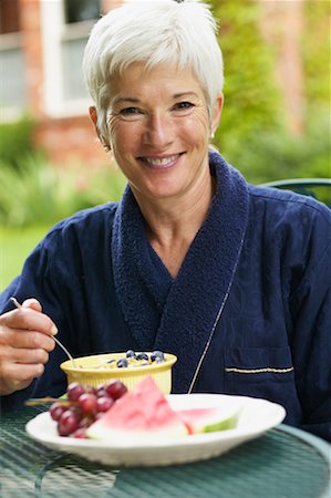 Woman Eating Breakfast Outdoors Stock Photo - Rights-Managed, Code: 700-00529224