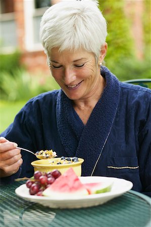 Woman Eating Breakfast Outdoors Stock Photo - Rights-Managed, Code: 700-00529225